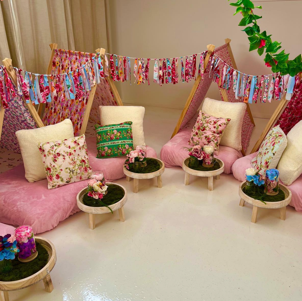 Four (4) pink cute teepees with bunting and pink blanket set up for a luxury indoor slumber party in Melbourne
