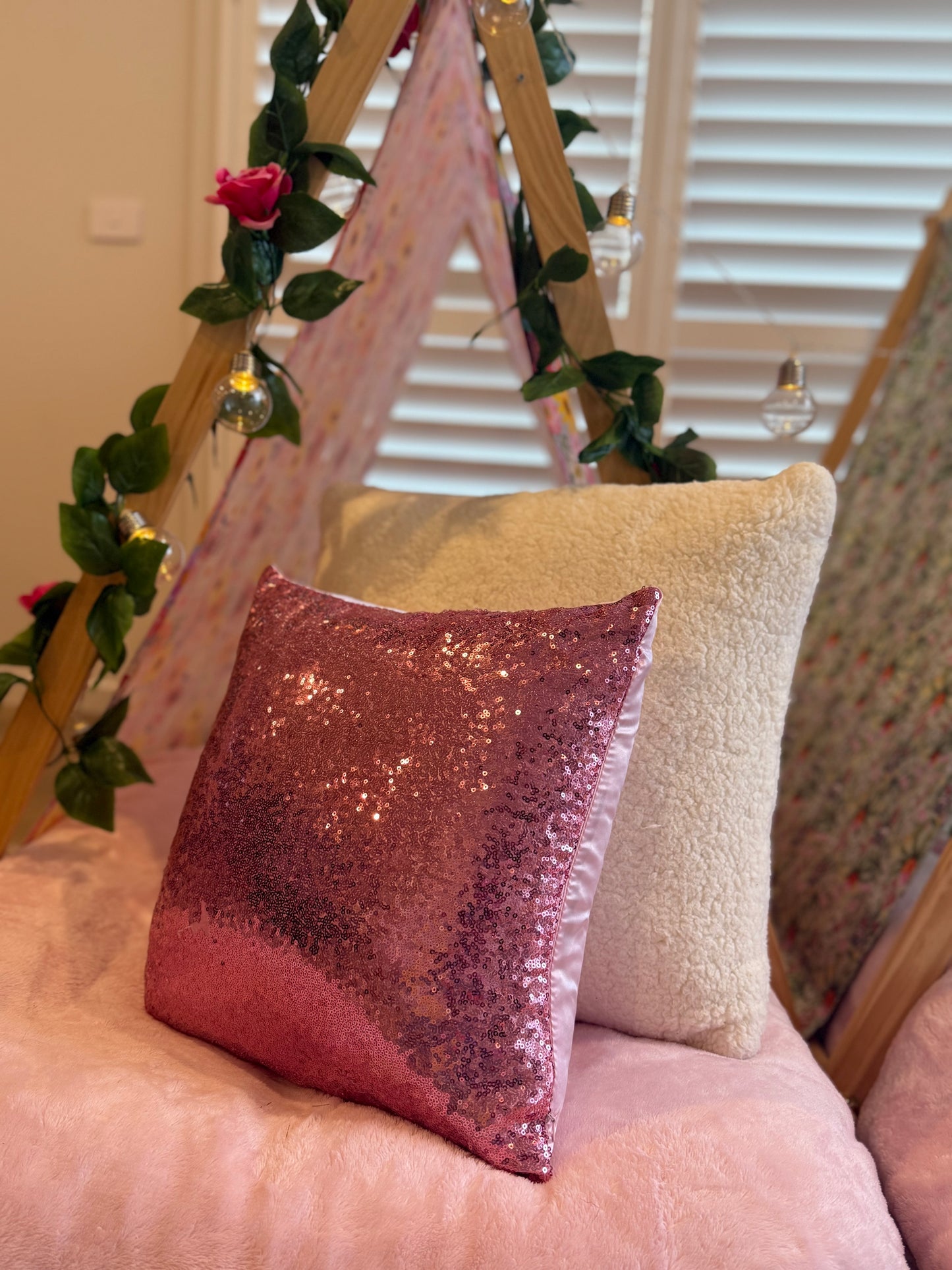 Flamingo-themed teepee setup with pink tents, pink bedding, and flamingo cushions for a cute ultimate girls’ sleepover
