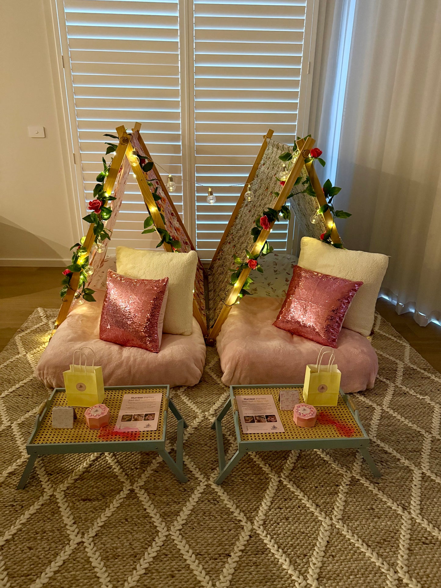 Flamingo-themed teepee setup with pink tents, pink bedding, and flamingo cushions for a cute ultimate girls’ sleepover