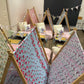 Six (6) colourful cute teepees with bunting, pink blanket, and twinkle lights set up for a luxury indoor slumber party in Melbourne