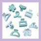 Kids assorted hair clips in colour light blue. Designs include flower, claw clip, swirl pattern, etc.