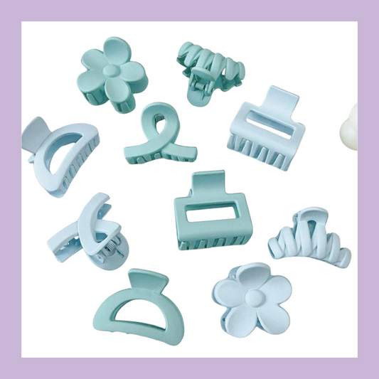 Kids assorted hair clips in colour light blue. Designs include flower, claw clip, swirl pattern, etc.