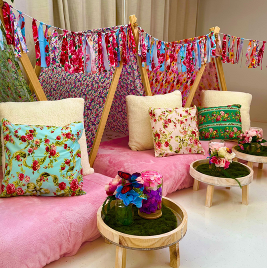 Boho teepee sleepover setup with fairy lights, pink tones, and decorative pillows for a girl's sleepover party in Melbourne, Australia.