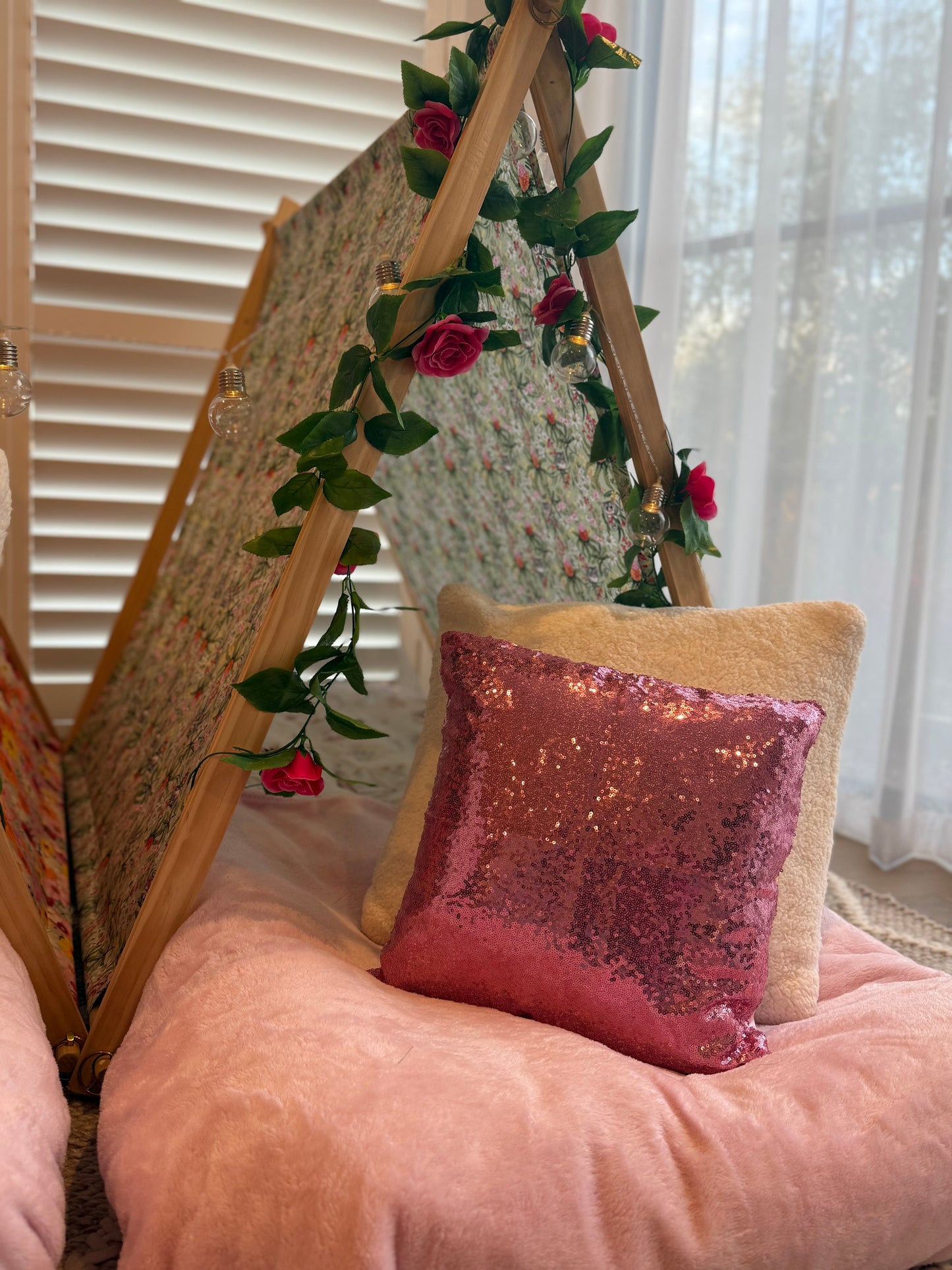 Flamingo-themed teepee setup with pink tents, pink bedding, and flamingo cushions for a cute ultimate girls’ sleepover